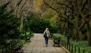 Woman walking a pathway in Central Park
