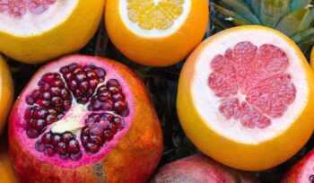 Colorful pomegranates and oranges