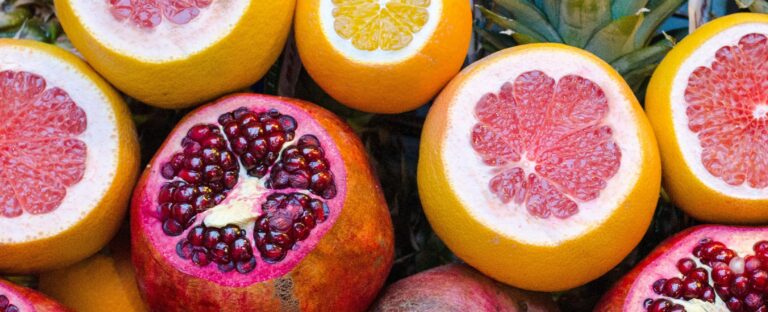 Colorful pomegranates and oranges