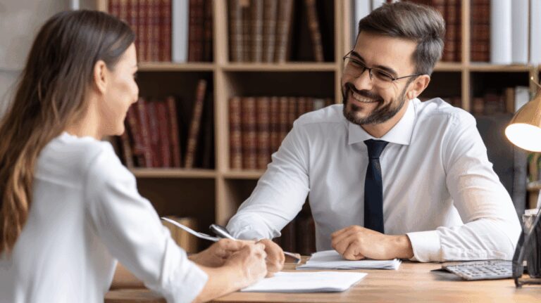 Friendly bankruptcy petition preparer helping client complete Chapter 7 paperwork at We The People office in New York City