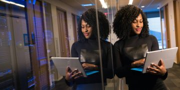 Entrepreneurial woman looking at a tablet at work.